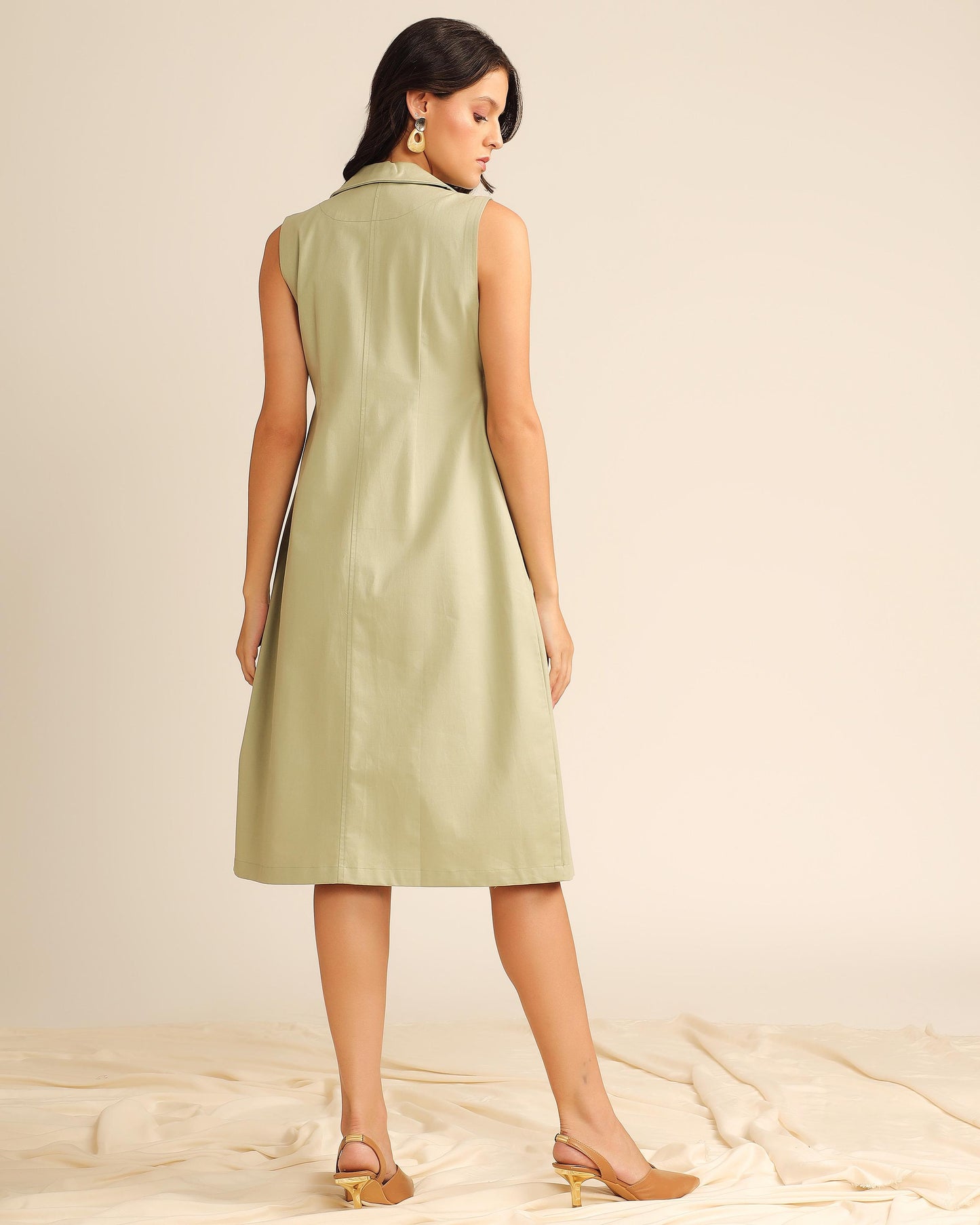 Light olive twill sleeveless midi dress back view with A-line silhouette and clean finish