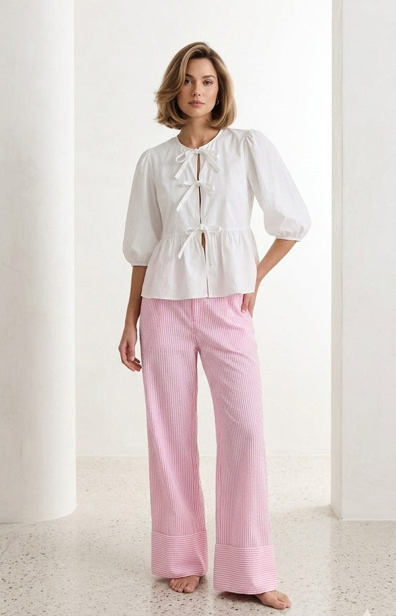Pink seersucker stripe relaxed straight-leg pants with a clean, easy fit front view