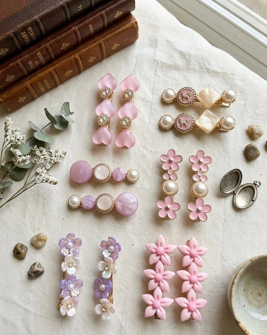 Pink hair pins set of 6 pairs with pearl style beads and gold clips on soft background