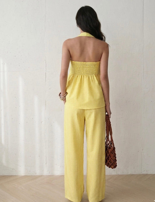 Back view of women’s yellow gingham halter co-ord set with relaxed straight fit pants and sleeveless flowy top